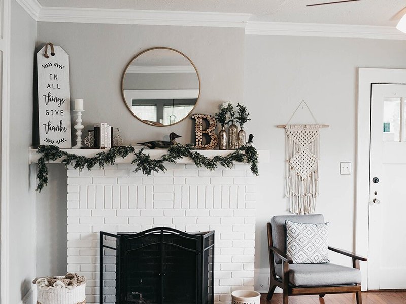 white fireplace in a living room with brown hardwood floor from Mendel Carpet & Flooring in Indianapolis, IN